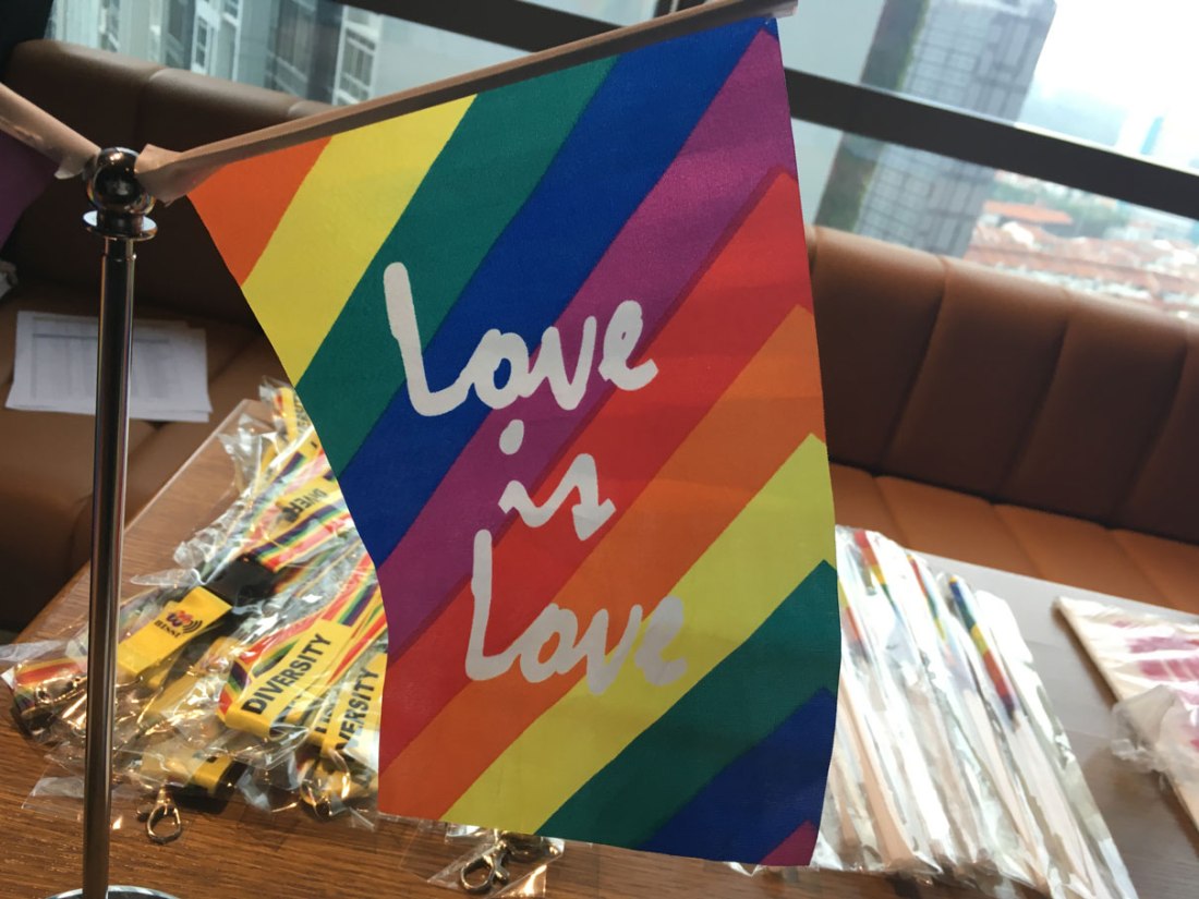 Pride flag with words "Love is love"