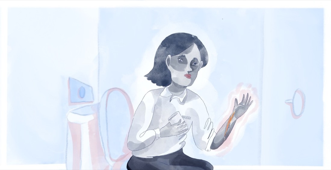 Toilet wall in a shade of baby blue. There's an empty toilet roll holder on the wall.